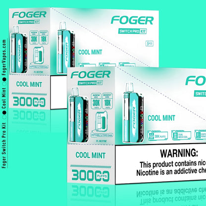 Bulk packaging of Foger Switch Pro Kit in Cool Mint flavor, containing 10 units. Each kit offers 30,000 puffs in Norm Mode or 18,000 puffs in Boost Mode with a stylish teal finish. Highlighted features include dual mesh coils, adjustable airflow, smart OLED display, and disposable power bank capability. Includes detailed nicotine warning for customer safety.