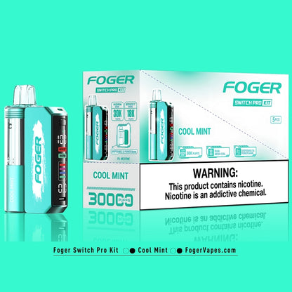 5-pack of Foger Switch Pro Kits in Cool Mint flavor, emphasizing 30,000 puffs in Norm Mode and 18,000 puffs in Boost Mode. The packaging showcases the dual mesh coil system, adjustable airflow, OLED screen, and rechargeable power bank functionality. Includes a nicotine warning label prominently displayed for compliance.