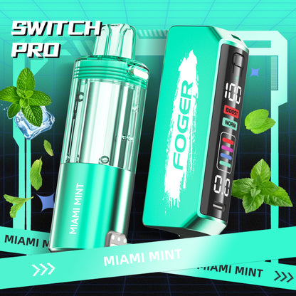 Foger Switch Pro Pod in Miami Mint flavor, paired with the innovative Foger Switch Pro Kit. Showcasing a refreshing mint-themed design with cool turquoise hues, mint leaf accents, and icy highlights, this pod delivers up to 30K puffs of invigorating and premium vaping satisfaction.