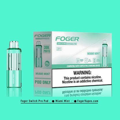 Foger Switch Pro Miami Mint Disposable Pod - 5-Pack Box. This premium vape pod pack delivers 30,000 puffs per pod with 5% nicotine strength. Featuring a sleek green design and dual mesh coil technology for optimal flavor and vapor production. Miami Mint flavor captures the essence of cool mint with a twist. Compatible with the Foger Switch Pro charging device, this pack ensures convenience and eco-conscious vaping.