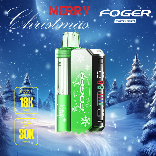 Foger Switch Pro 30K Puffs Holiday Edition Peppermint flavor with vibrant green accents. Delivers 18K puffs in Boost mode, 30K puffs in Norm mode, and advanced LCD functionality, displayed in a winter wonderland scene.