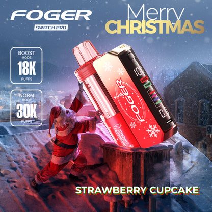 Foger Switch Pro 30K Puffs Holiday Edition Strawberry Cupcake flavor in a holiday themed red design. Offers 18K Boost and 30K Norm puffs with an LCD display, shown in a playful Santa rooftop setting.